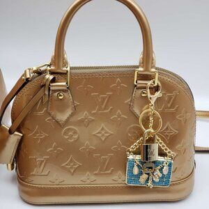 100% Auth Louis Vuitton Lock & Key with unbranded Bagcharm, Keycharm, Keychain